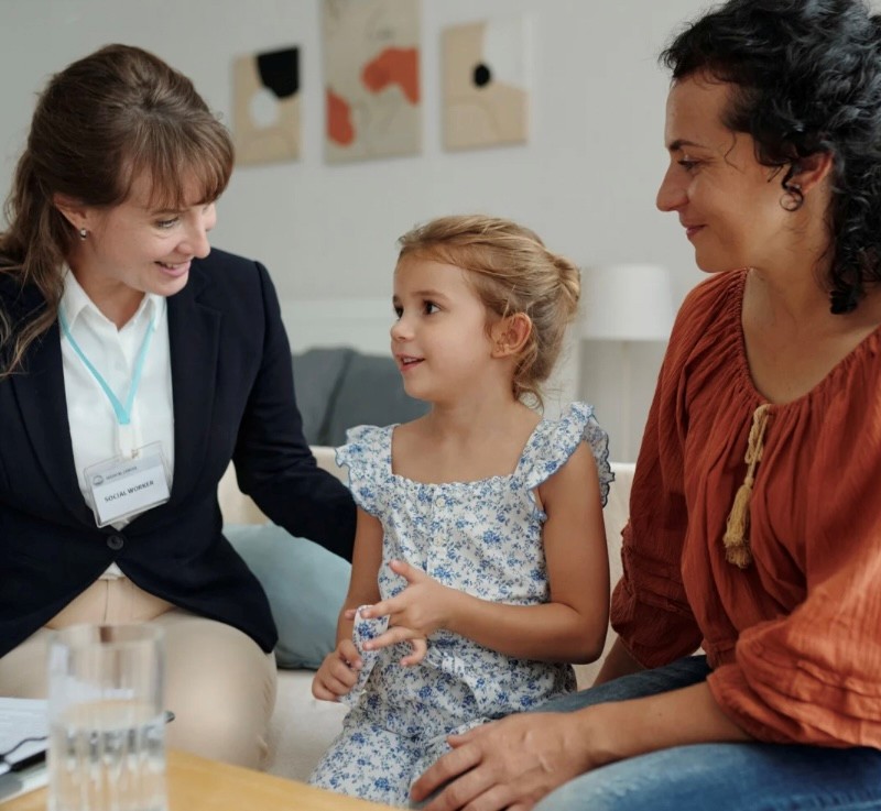 social worker with mom and daughter
